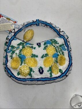 YELLOW AND BLUE BEADED BAG WITH LEMON DESIGN AND LEMON ZIPPER PULL
NEW WITH TAG